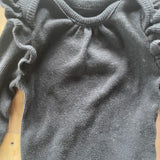 Black Ruffle Shoulder Long Sleeve Onesie | Garanimals