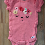 Pink Floral Face Onesie | newborn | Gerber